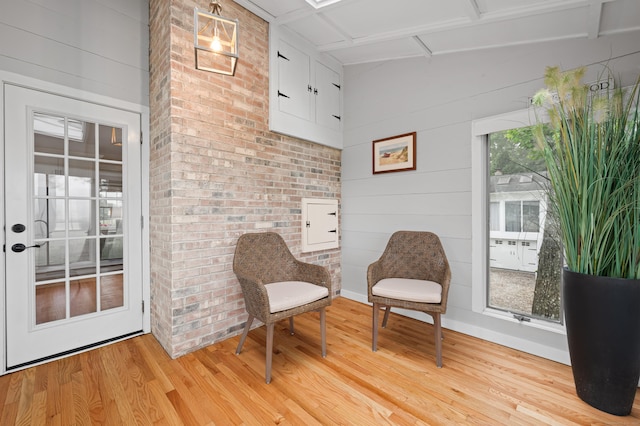 55 Cypress Rd, Old Saybrook, CT 06475 - sitting room featuring light wood finished floors, attic access, and wooden walls