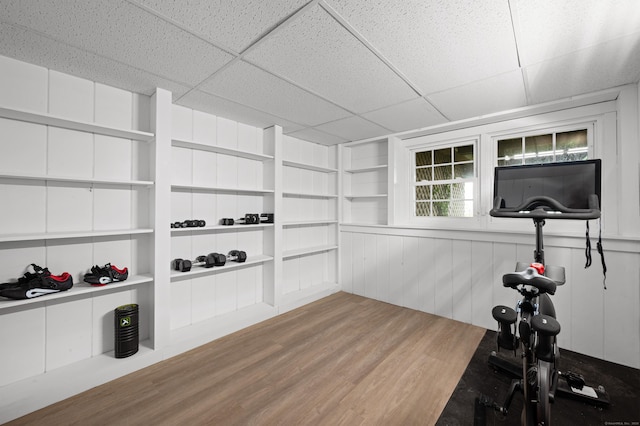 55 Cypress Rd, Old Saybrook, CT 06475 - workout room with wood finished floors, built in shelves, and a drop ceiling