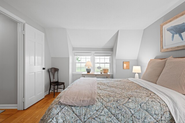 55 Cypress Rd, Old Saybrook, CT 06475 - bedroom featuring wood finished floors and lofted ceiling