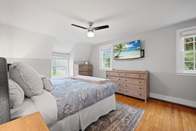 55 Cypress Rd, Old Saybrook, CT 06475 - bedroom with light wood-style floors, a ceiling fan, a baseboard heating unit, and lofted ceiling