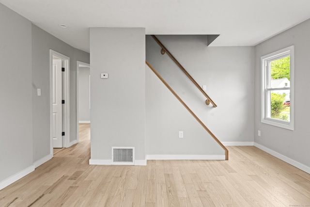 32 Porterbrook Ave, East Hartford, CT 06118 - unfurnished living room featuring wood finished floors, baseboards, and stairs