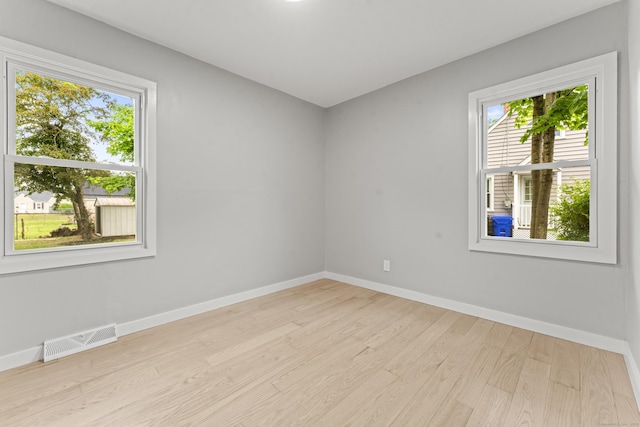 32 Porterbrook Ave, East Hartford, CT 06118 - spare room with plenty of natural light, wood finished floors, and baseboards