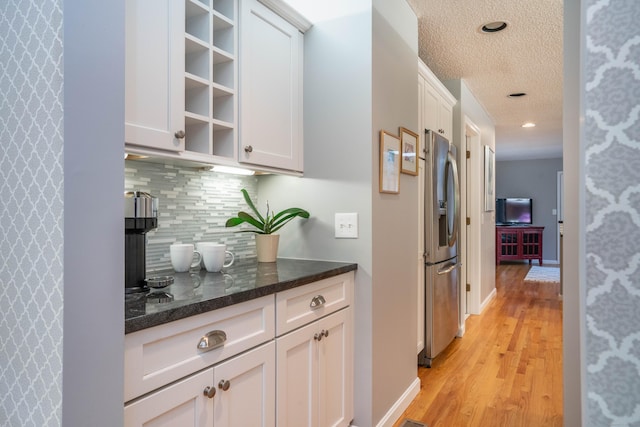 53 Bathcrescent Ln Unit 53, Bloomfield, CT 06002 - corridor featuring light wood finished floors, a textured ceiling, recessed lighting, and baseboards