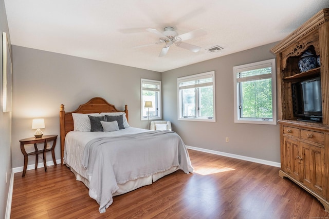 53 Bathcrescent Ln Unit 53, Bloomfield, CT 06002 - bedroom featuring multiple windows, light wood-type flooring, baseboards, and a ceiling fan