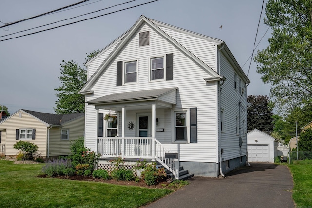 115 Ashland Ave, Newington, CT 06111 - view of front of home featuring covered porch, an outdoor structure, a garage, a front yard, and driveway