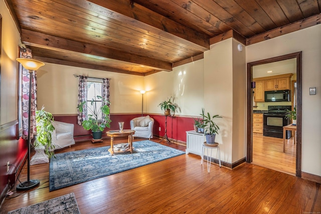115 Ashland Ave, Newington, CT 06111 - living area with wooden ceiling with exposed beams and wood-type flooring