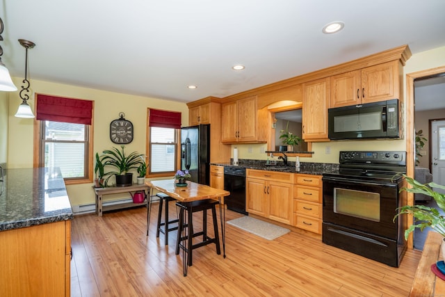 115 Ashland Ave, Newington, CT 06111 - kitchen featuring black appliances, a sink, light wood-style floors, recessed lighting, and hanging light fixtures