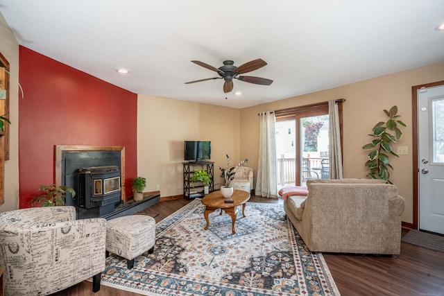 115 Ashland Ave, Newington, CT 06111 - living room featuring a wood stove, wood finished floors, ceiling fan, recessed lighting, and baseboards