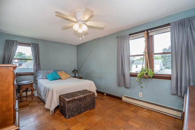 115 Ashland Ave, Newington, CT 06111 - bedroom featuring a baseboard heating unit, wallpapered walls, a baseboard radiator, baseboards, and a ceiling fan