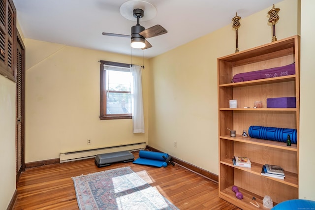 115 Ashland Ave, Newington, CT 06111 - interior space featuring a baseboard radiator, ceiling fan, wood finished floors, and baseboards