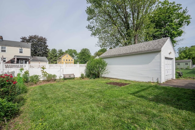 115 Ashland Ave, Newington, CT 06111 - view of yard featuring an outbuilding and a detached garage