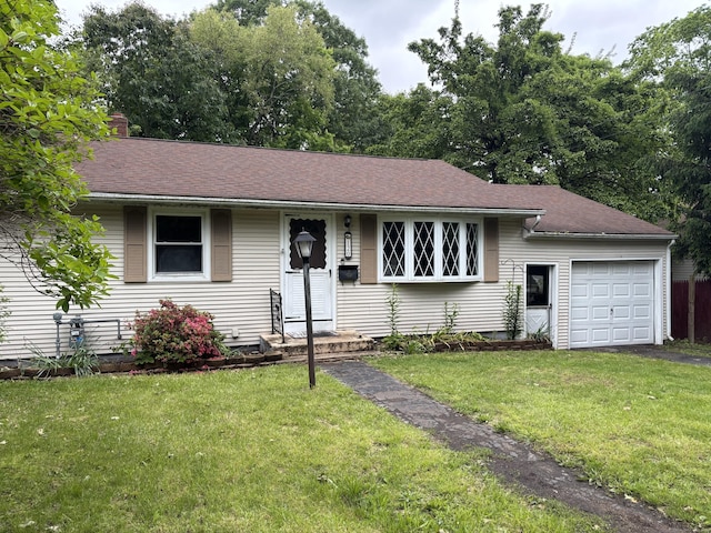 120 Wall St, Meriden, CT 06450 - view of front of home with a garage, a front lawn, driveway, and a shingled roof