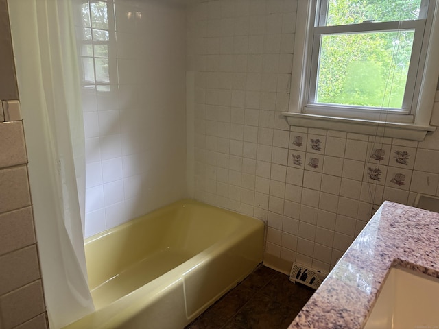 120 Wall St, Meriden, CT 06450 - bathroom with tile walls, tile patterned flooring, shower / tub combo, and vanity