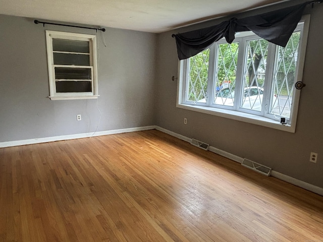 120 Wall St, Meriden, CT 06450 - empty room featuring wood finished floors and baseboards
