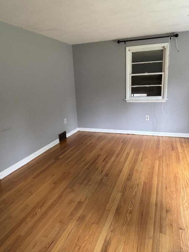 120 Wall St, Meriden, CT 06450 - empty room featuring wood finished floors and baseboards