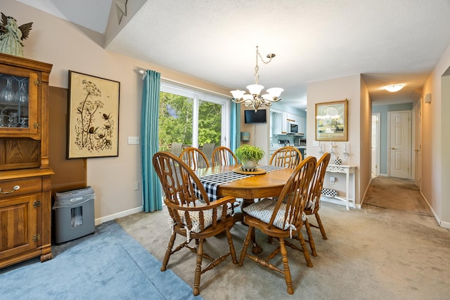 76 River St W, Old Saybrook, CT 06475 - dining room with light colored carpet and a chandelier