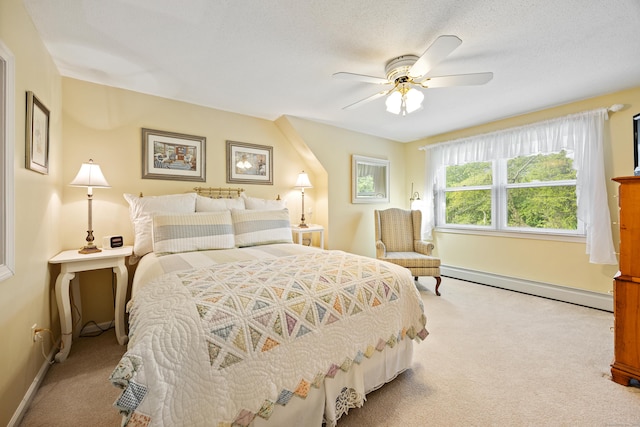 76 River St W, Old Saybrook, CT 06475 - carpeted bedroom featuring a baseboard radiator and a ceiling fan