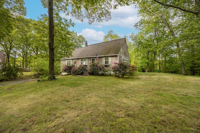 76 River St W, Old Saybrook, CT 06475 - view of side of home with a chimney and a lawn