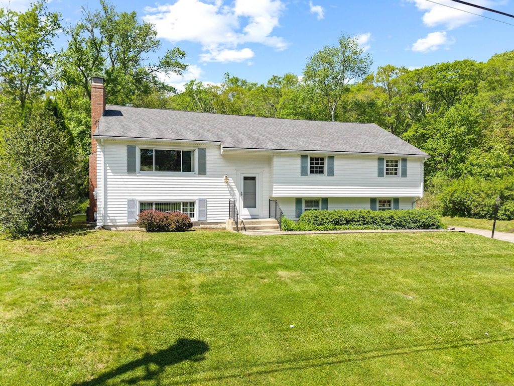 5 Old Colony Rd, North Stonington, CT 06359 - split foyer home with a chimney and a front yard