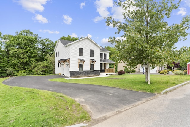 116 Joshua Town Rd, Waterbury, CT 06708 - view of front of home featuring a front lawn, driveway, and covered porch