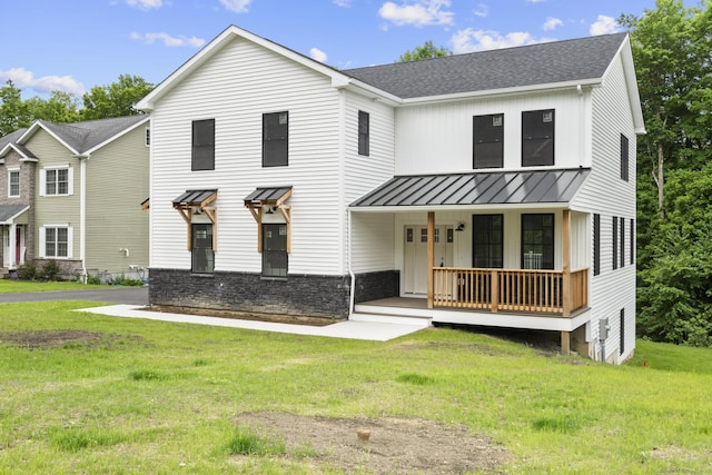 116 Joshua Town Rd, Waterbury, CT 06708 - modern farmhouse with covered porch, a standing seam roof, a front yard, roof with shingles, and metal roof