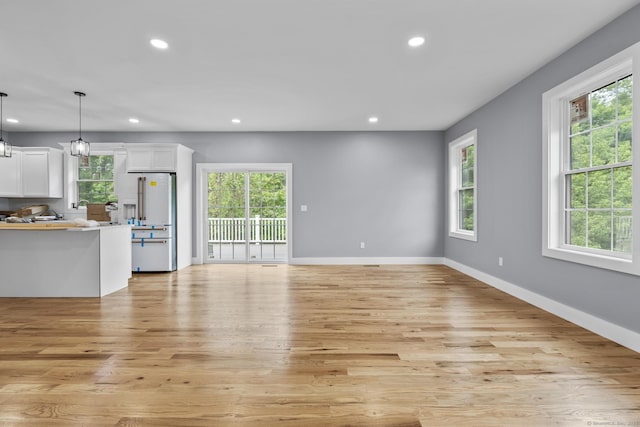 116 Joshua Town Rd, Waterbury, CT 06708 - unfurnished living room featuring recessed lighting, plenty of natural light, light wood-style floors, and baseboards