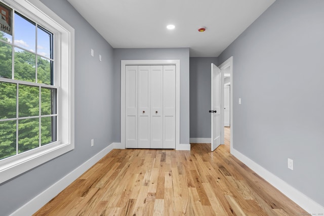 116 Joshua Town Rd, Waterbury, CT 06708 - unfurnished bedroom featuring multiple windows, baseboards, light wood finished floors, and recessed lighting