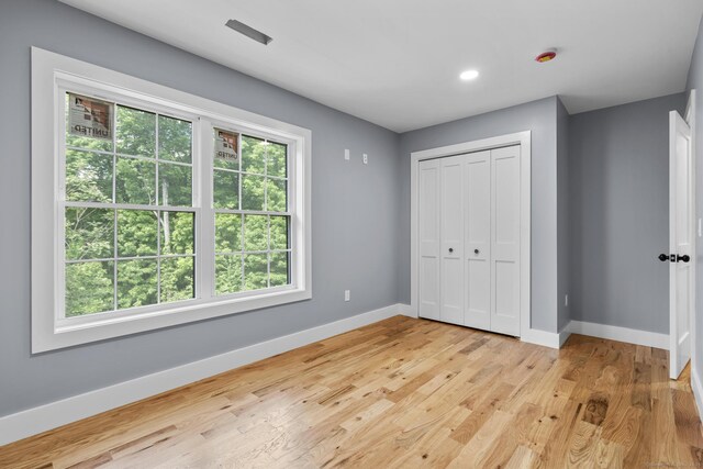116 Joshua Town Rd, Waterbury, CT 06708 - unfurnished bedroom with baseboards, light wood-style floors, a closet, and recessed lighting