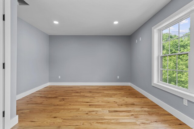 116 Joshua Town Rd, Waterbury, CT 06708 - empty room with healthy amount of natural light, recessed lighting, light wood finished floors, and baseboards