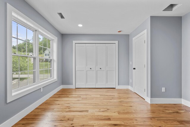 116 Joshua Town Rd, Waterbury, CT 06708 - unfurnished bedroom with baseboards, light wood-type flooring, recessed lighting, and a closet