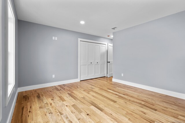 116 Joshua Town Rd, Waterbury, CT 06708 - unfurnished bedroom featuring light wood-type flooring, baseboards, a closet, and recessed lighting