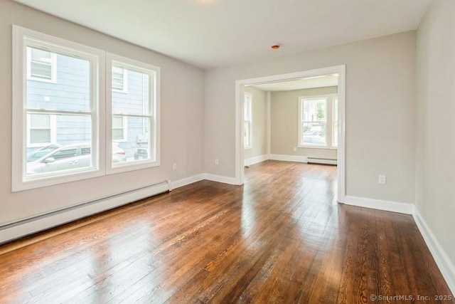 34 Wilbur Ave, Meriden, CT 06450 - spare room with a baseboard radiator, dark wood-type flooring, baseboard heating, and baseboards