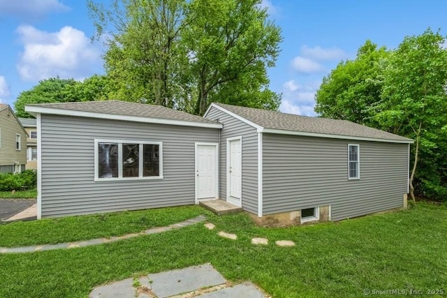 34 Wilbur Ave, Meriden, CT 06450 - view of front facade featuring a front lawn and roof with shingles