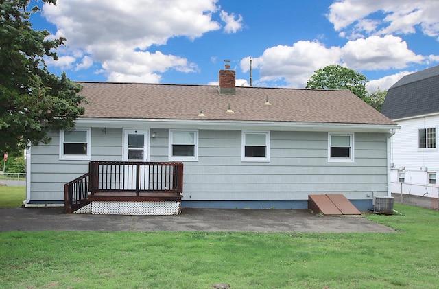 58 Wade St, West Haven, CT 06516 - rear view of property with a chimney, a yard, central air condition unit, and roof with shingles
