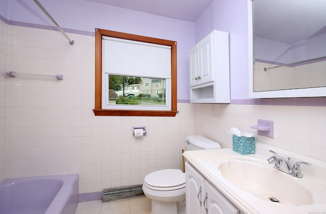 58 Wade St, West Haven, CT 06516 - bathroom featuring tile walls, toilet, vanity, and tile patterned floors