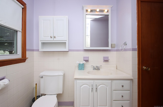 58 Wade St, West Haven, CT 06516 - half bath featuring toilet, vanity, tile walls, and wainscoting