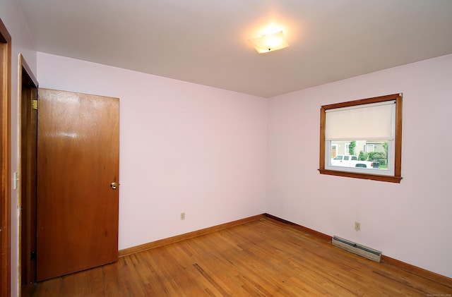 58 Wade St, West Haven, CT 06516 - spare room with a baseboard radiator, light wood-type flooring, and baseboards