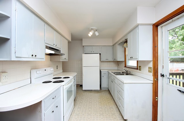 58 Wade St, West Haven, CT 06516 - kitchen featuring white appliances, under cabinet range hood, a sink, light floors, and light countertops