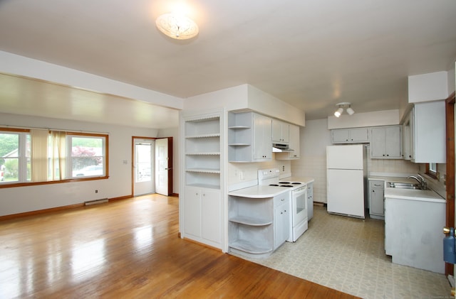 58 Wade St, West Haven, CT 06516 - kitchen featuring white appliances, open shelves, under cabinet range hood, light countertops, and healthy amount of natural light