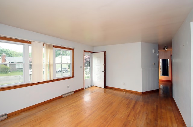 58 Wade St, West Haven, CT 06516 - empty room featuring wood finished floors, baseboards, and a baseboard radiator