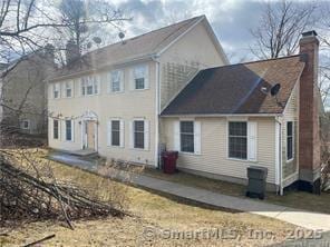 7 Fawn Meadow Dr, Naugatuck, CT 06770 - rear view of property featuring a chimney
