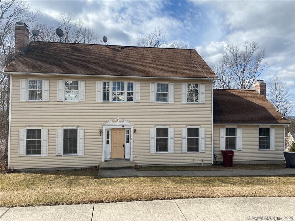 7 Fawn Meadow Dr, Naugatuck, CT 06770 - colonial inspired home with a chimney and a front lawn