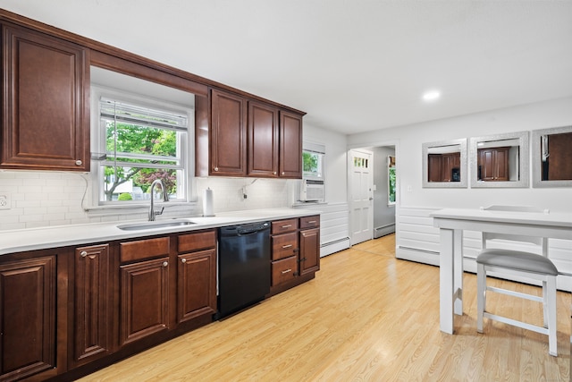 10 Ciccio Ct, Plainville, CT 06062 - kitchen with black dishwasher, a sink, a baseboard radiator, tasteful backsplash, and light countertops