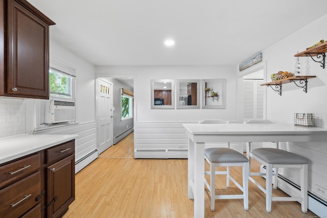 10 Ciccio Ct, Plainville, CT 06062 - kitchen with a baseboard radiator, open shelves, light countertops, and recessed lighting