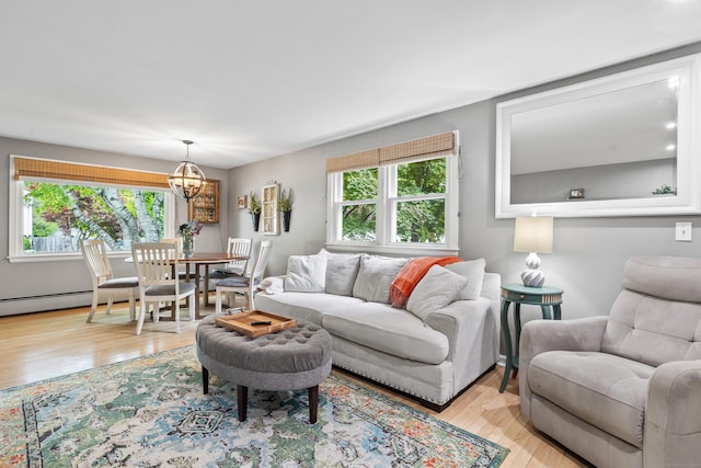 10 Ciccio Ct, Plainville, CT 06062 - living area with a chandelier and wood finished floors