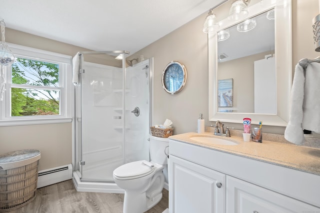 10 Ciccio Ct, Plainville, CT 06062 - full bath with a baseboard radiator, vanity, a stall shower, toilet, and wood finished floors