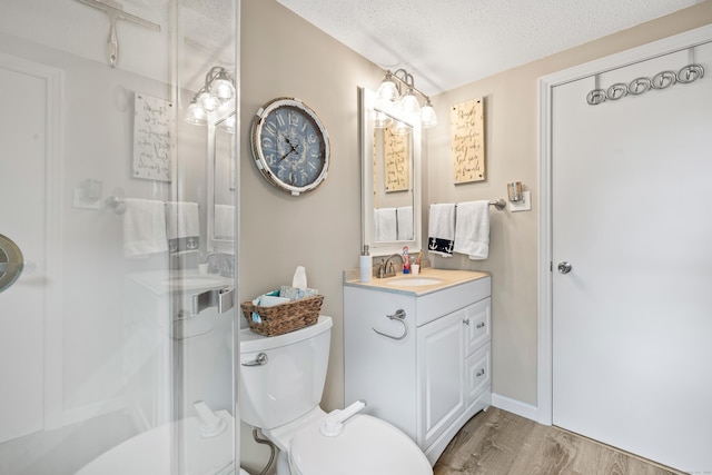 10 Ciccio Ct, Plainville, CT 06062 - full bathroom with wood finished floors, vanity, a stall shower, a textured ceiling, and toilet