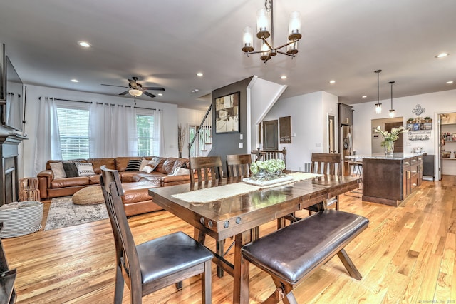905 New Britain Ave, Farmington, CT 06032 - dining space featuring stairs, a ceiling fan, light wood-style flooring, recessed lighting, and a chandelier