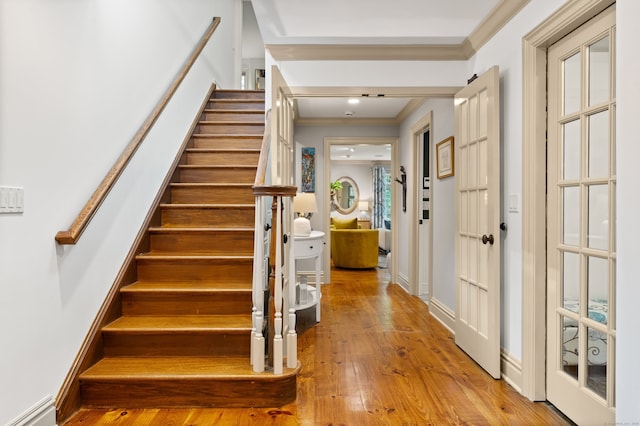 99 Cross Hwy, Redding, CT 06896 - stairs with crown molding, hardwood / wood-style flooring, and a baseboard heating unit