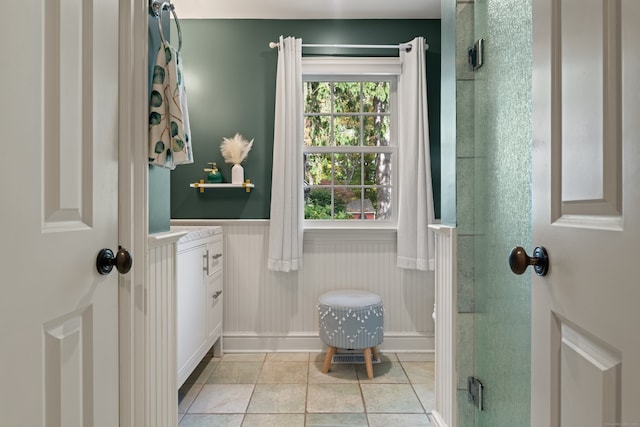 99 Cross Hwy, Redding, CT 06896 - bathroom featuring a wainscoted wall, vanity, a shower stall, and tile patterned floors